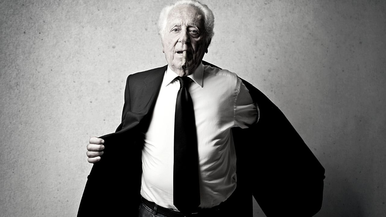 Mature backing off his suit jacket with a cigar hanging from the corner of his mouth. As the boss do you break your own rules?